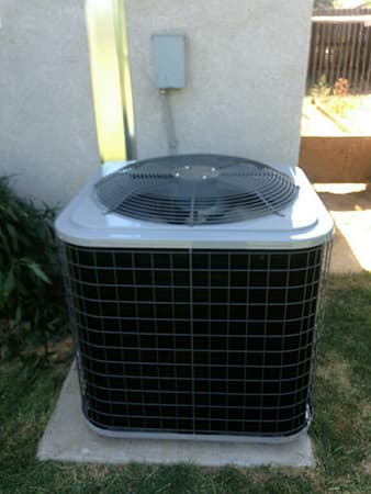 Clean outdoor AC condenser unit serviced by MG's Air in the Central Valley
