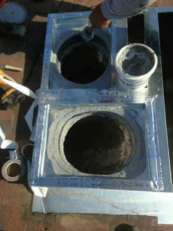 MG's Air technician repairing a rooftop air conditioning package unit in Tulare, CA