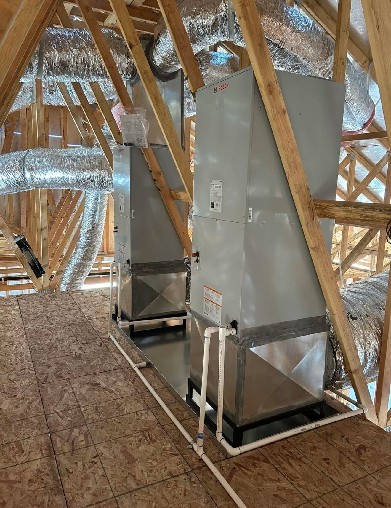 Two Bosch air handlers installed in an attic by MG's Air Conditioning & Heating