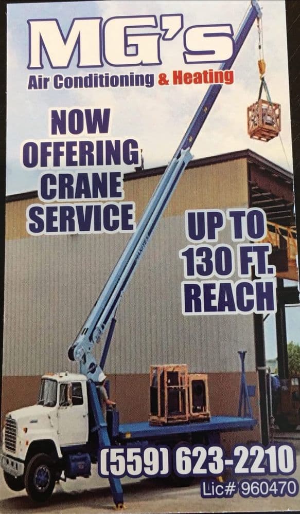 MG's Air crane truck lifting a rooftop HVAC unit, crane service up to 130 ft reach