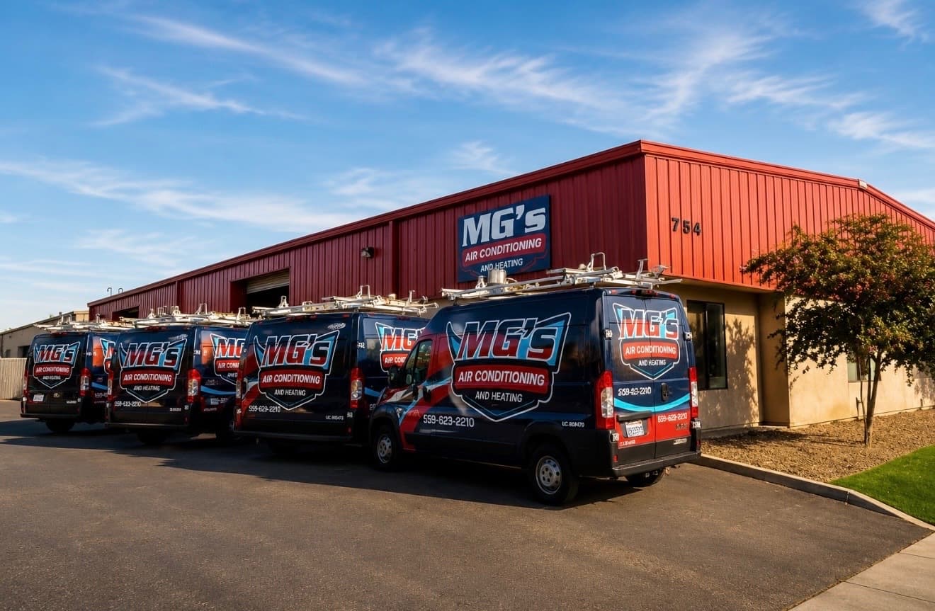 MG's Air Conditioning & Heating service van fleet parked at the Visalia shop on N Gateway St