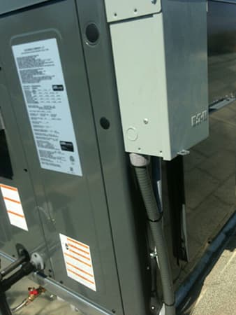HVAC package unit and electrical disconnect installed by MG's Air