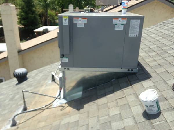 New rooftop HVAC package unit installed by MG's Air Conditioning & Heating on a home in Tulare County