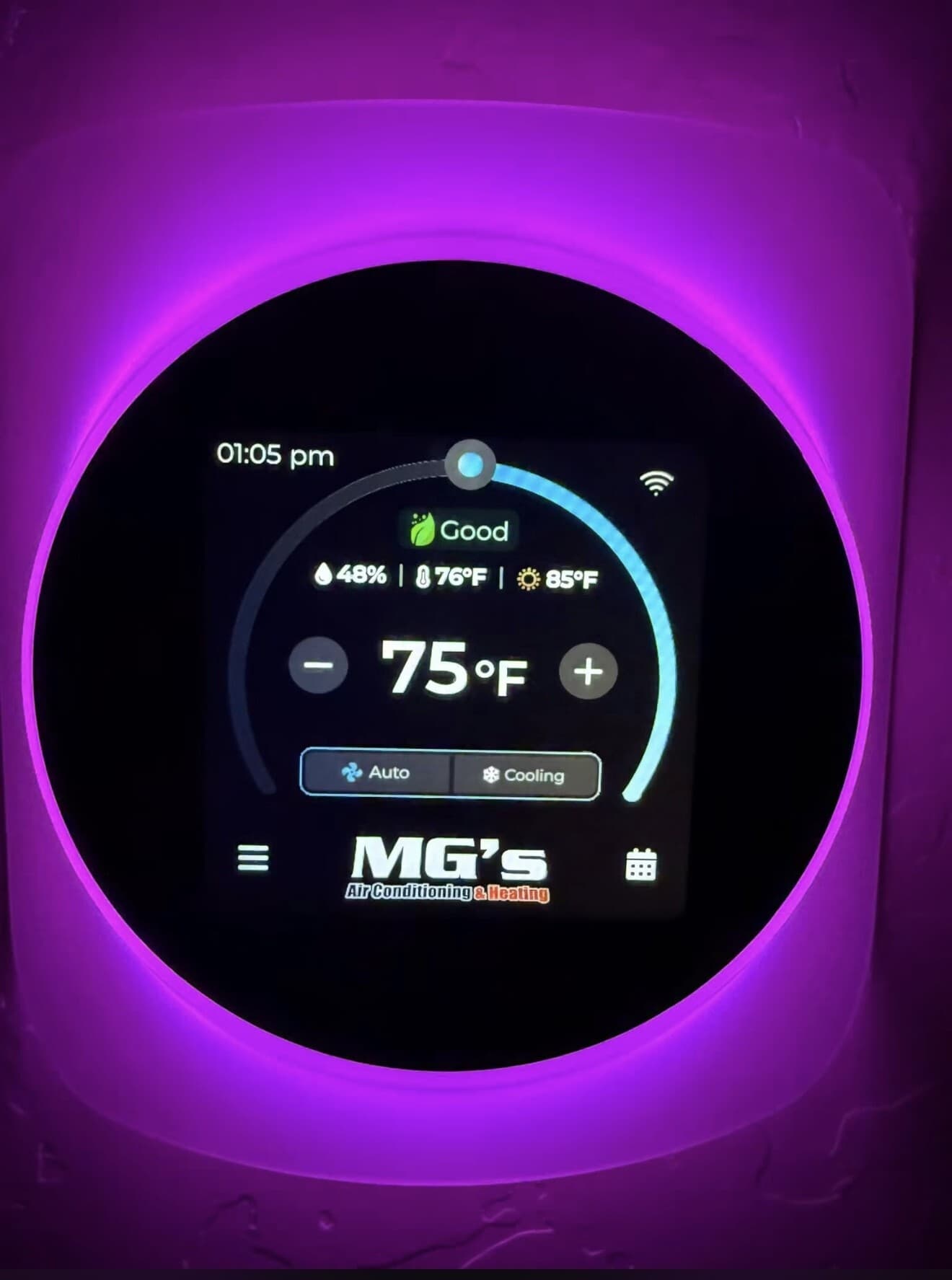 Smart thermostat installed on a living room wall by MG's Air