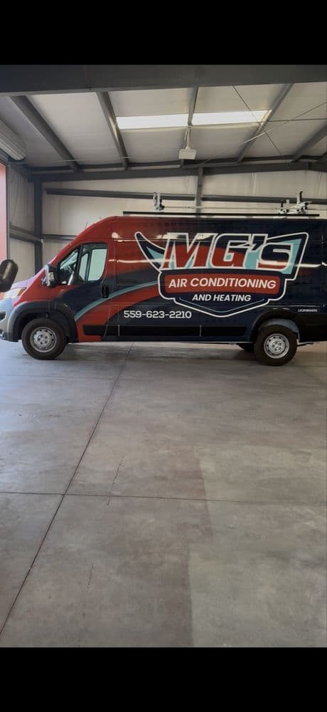 MG's Air Conditioning & Heating wrapped Ram ProMaster service van