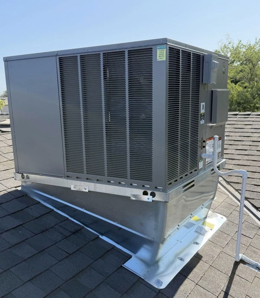 Rheem rooftop package unit installed by MG's Air Conditioning & Heating on a Central Valley roof